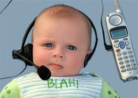 simsearch:400-04291703,k - Baby with a headset on a blue background Stock Photo - Budget Royalty-Free & Subscription, Code: 400-03938025