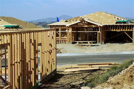 simsearch:696-03398582,k - Construction site with new home framing. Stockbilder - Microstock & Abonnement, Bildnummer: 400-03938100