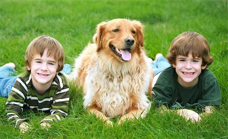 simsearch:400-05875962,k - Boys Laying in Grass with the Dog Photographie de stock - Aubaine LD & Abonnement, Code: 400-03938247