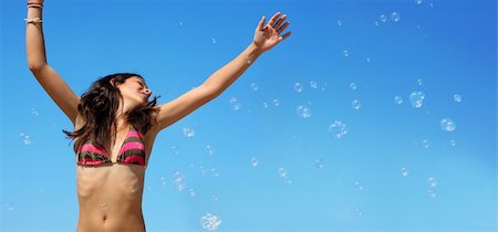 simsearch:6109-06195368,k - Happy girl playing with bubbles on the beach Stock Photo - Budget Royalty-Free & Subscription, Code: 400-03938286
