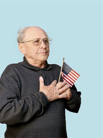 simsearch:400-08654218,k - Senior man with american flag isolated Photographie de stock - Aubaine LD & Abonnement, Code: 400-03938443