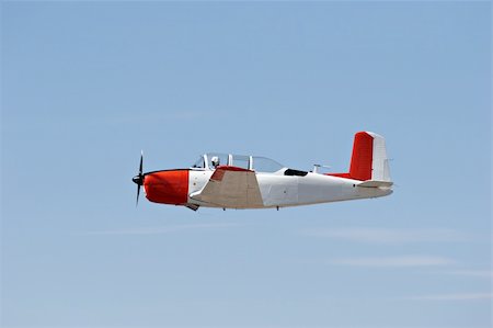 simsearch:400-06067518,k - vintage airplane - an old navy aircraft in flight against blue sky Photographie de stock - Aubaine LD & Abonnement, Code: 400-03938538