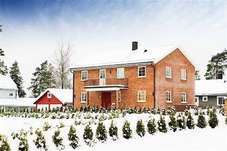snow cosy - A large brick house in a nice neighborhood surrounded by bushes. Stock Photo - Budget Royalty-Free & Subscription, Code: 400-03938787