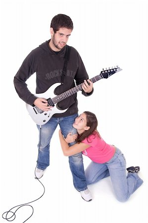 simsearch:400-03910203,k - Young electric guitar player with beautiful young girl grabbing his leg Foto de stock - Super Valor sin royalties y Suscripción, Código: 400-03938825