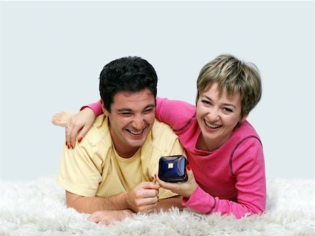 simsearch:400-04377128,k - Young couple lying on the rug Stock Photo - Budget Royalty-Free & Subscription, Code: 400-03938956