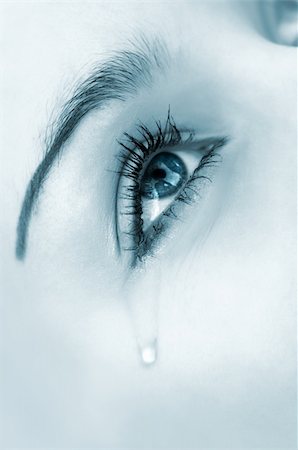 crying woman's eye. tinted monochrome image, high key, selective focus Stock Photo - Budget Royalty-Free & Subscription, Code: 400-03939161