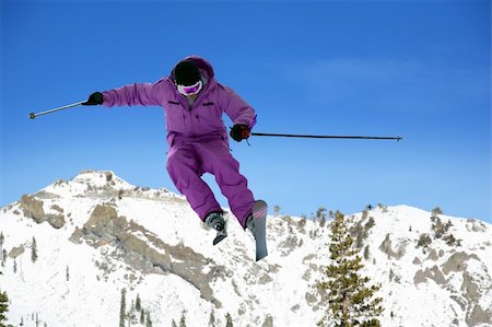 simsearch:400-03938721,k - Skier jumping against the sky and mountains Photographie de stock - Aubaine LD & Abonnement, Code: 400-03939394