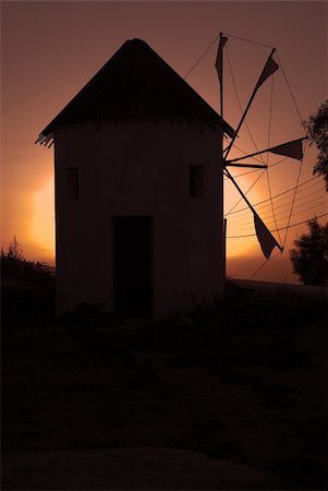 Windmill in the sunset of Santorini, Greece Foto de stock - Super Valor sin royalties y Suscripción, Código: 400-03939425