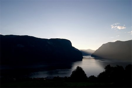 simsearch:400-03946853,k - Fjord in western Norway as the sun goes down - great copyspace in the bottom area, or sky. Stockbilder - Microstock & Abonnement, Bildnummer: 400-03939516