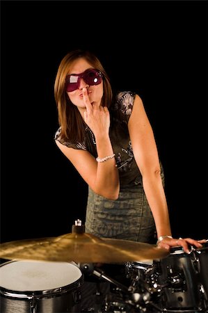 simsearch:400-06133570,k - woman with expression on drum set over black backdrop Stock Photo - Budget Royalty-Free & Subscription, Code: 400-03939601