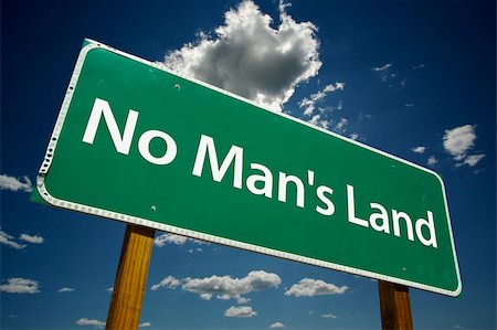 simsearch:400-04691775,k - "No Man's Land" Road Sign with dramatic blue sky and clouds. Stockbilder - Microstock & Abonnement, Bildnummer: 400-03939720