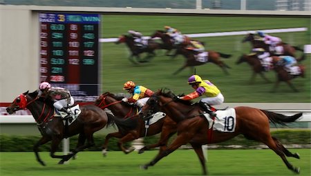 simsearch:400-03963631,k - The Horse Racing at Hong Kong Jockey Club, big screen on the background. (got some noise due to high ISO and slight blurry for motion effect) Photographie de stock - Aubaine LD & Abonnement, Code: 400-03939851