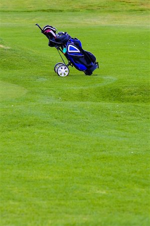 simsearch:400-03939873,k - Golfing equipment in the bag over the grass. Shallow depth of field Stock Photo - Budget Royalty-Free & Subscription, Code: 400-03939872