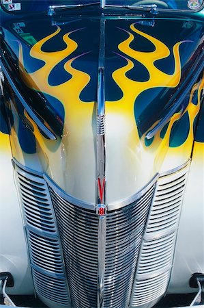 Hood and fender detail of a customized street rod at the Street Rod Nationals in Louisville Kentucky Stock Photo - Budget Royalty-Free & Subscription, Code: 400-03930541