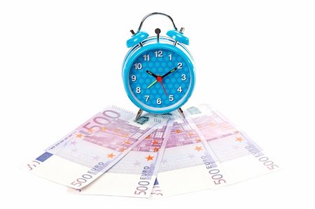 Blue alarm clock with bells over a fan of money Photographie de stock - Aubaine LD & Abonnement, Code: 400-03930922