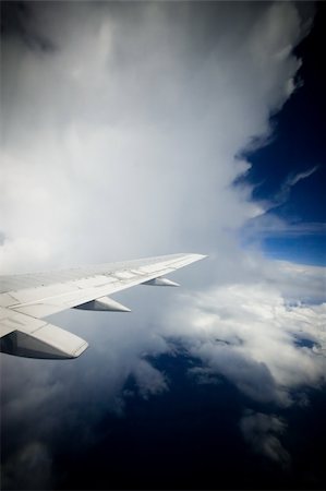 plane rain - Plane flying into a large white cloud in the air Stock Photo - Budget Royalty-Free & Subscription, Code: 400-03931009
