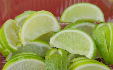 fedotishe (artist) - Close-up of slices of fresh green lime Foto de stock - Super Valor sin royalties y Suscripción, Código: 400-03931019