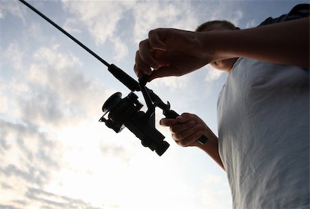 Boy Fishing at Sunrise Stock Photo - Budget Royalty-Free & Subscription, Code: 400-03931136