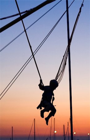 sich herumwälzen - A boy enjoys the mid-air. Stockbilder - Microstock & Abonnement, Bildnummer: 400-03931282