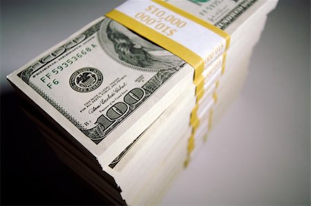 Stacks of Hundred Dollar Bills on a white background. Photographie de stock - Aubaine LD & Abonnement, Code: 400-03931389