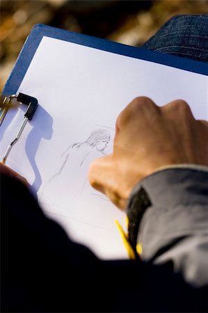 simsearch:690-06188906,k - man sitting and drawing picture in nature with pencil Photographie de stock - Aubaine LD & Abonnement, Code: 400-03931403