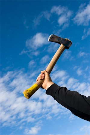 simsearch:632-01145244,k - hand with an axe on sky background Photographie de stock - Aubaine LD & Abonnement, Code: 400-03931692