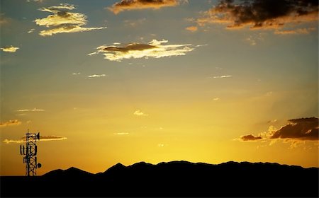 Wide shot of sunset with a telecommunications tower bottom left. Stock Photo - Budget Royalty-Free & Subscription, Code: 400-03931935