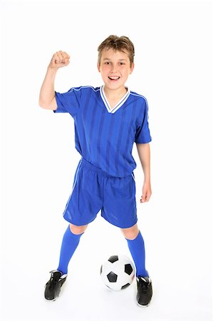 A boy in soccer jersey and shorts with fists in victory Stock Photo - Budget Royalty-Free & Subscription, Code: 400-03931998
