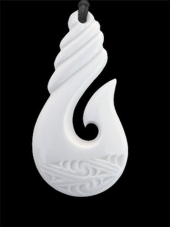 ANew Zealand Maori Bone carved pendant in the shape of a fish hook Photographie de stock - Aubaine LD & Abonnement, Code: 400-03932036