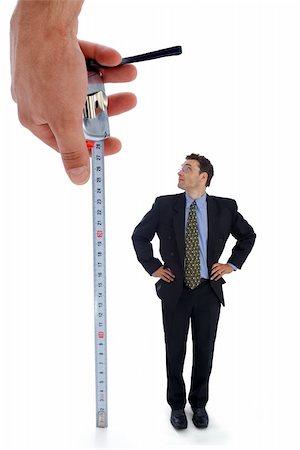 Measuring a men. Metaphoric view of a test before employment Stock Photo - Budget Royalty-Free & Subscription, Code: 400-03932253