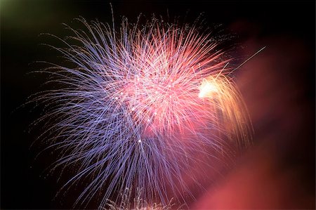 simsearch:841-06032575,k - Fireworks blowing in the sky at night Stock Photo - Budget Royalty-Free & Subscription, Code: 400-03933636