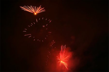 simsearch:841-06032575,k - Fireworks blowing in the sky at night Stock Photo - Budget Royalty-Free & Subscription, Code: 400-03933639