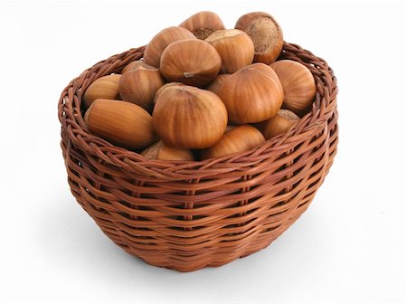 filling basket - Ripe hazelnuts filling a wattle basket Stock Photo - Budget Royalty-Free & Subscription, Code: 400-03933658