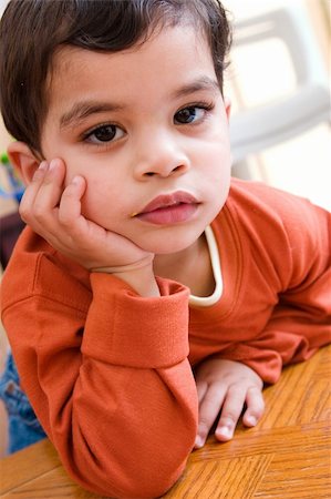 Cute child with a solid bored look on him Stock Photo - Budget Royalty-Free & Subscription, Code: 400-03944001