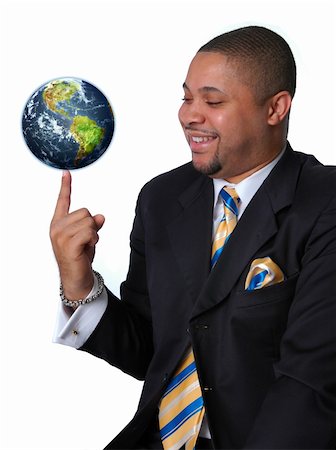 Young African American businessman balancing the earth on his finger. Foto de stock - Royalty-Free Super Valor e Assinatura, Número: 400-03944205