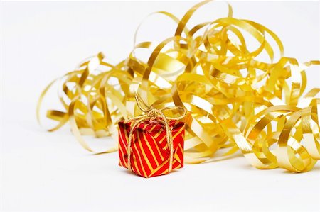 simsearch:400-07107254,k - Christmas decoration made of golden ribbon and small present Photographie de stock - Aubaine LD & Abonnement, Code: 400-03944235