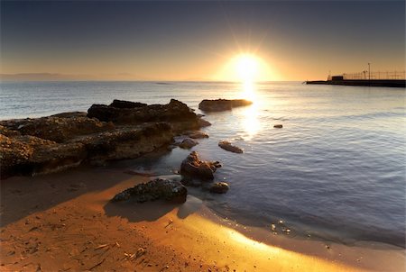 summer beach postcard - A very bright sunrise over a Mediterranean rocky seascape. Stock Photo - Budget Royalty-Free & Subscription, Code: 400-03944355