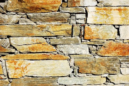 simsearch:622-07108951,k - Detail of a colorful stone wall Foto de stock - Royalty-Free Super Valor e Assinatura, Número: 400-03944449