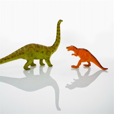 Plastic toy Tyrannosaurus and Apatosaurus  dinosaurs. Fotografie stock - Microstock e Abbonamento, Codice: 400-03944788