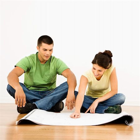 simsearch:673-02141754,k - Attractive young adult couple looking at house plans. Stock Photo - Budget Royalty-Free & Subscription, Code: 400-03944922