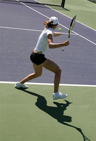 simsearch:400-08755898,k - Woman playing tennis at the professional tournament Stock Photo - Budget Royalty-Free & Subscription, Code: 400-03944986