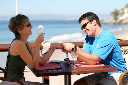 Happy couple at a seaside cafe Stock Photo - Budget Royalty-Free & Subscription, Code: 400-03944995