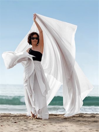 Woman on the beach with a white scarf Stock Photo - Budget Royalty-Free & Subscription, Code: 400-03945132