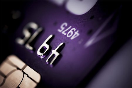 simsearch:400-05692102,k - Credit card on dark background purple tone Photographie de stock - Aubaine LD & Abonnement, Code: 400-03945379