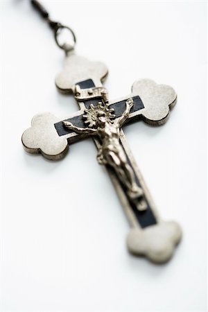 simsearch:400-05080477,k - Christian rosary crucifix on white background. Stock Photo - Budget Royalty-Free & Subscription, Code: 400-03945385