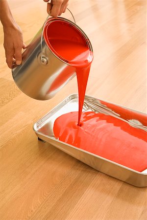 paint poured on someone - Caucasian woman pouring red paint from can into tray. Stock Photo - Budget Royalty-Free & Subscription, Code: 400-03945549