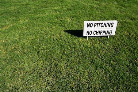 simsearch:400-03945601,k - No Pitching, No Chipping sign in Lush Green Golf Course Grass. Stock Photo - Budget Royalty-Free & Subscription, Code: 400-03945598