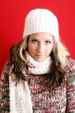 dee21 (artist) - winter portrait of a beautiful young woman is freezing with a cap and a scarf Foto de stock - Royalty-Free Super Valor e Assinatura, Número: 400-03946179