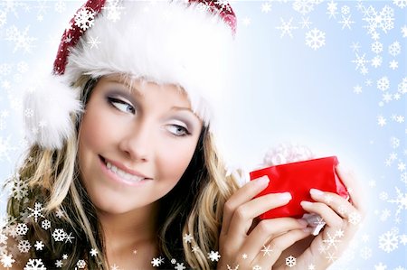 shocked face animal - winter portrait of a smiling woman with a gift in her hands and snowflakes Stock Photo - Budget Royalty-Free & Subscription, Code: 400-03946181