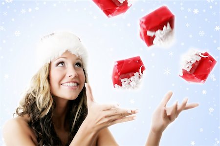 shocked face animal - winter portrait of a smiling woman with a gift in her hands and snowflakes Stock Photo - Budget Royalty-Free & Subscription, Code: 400-03946182